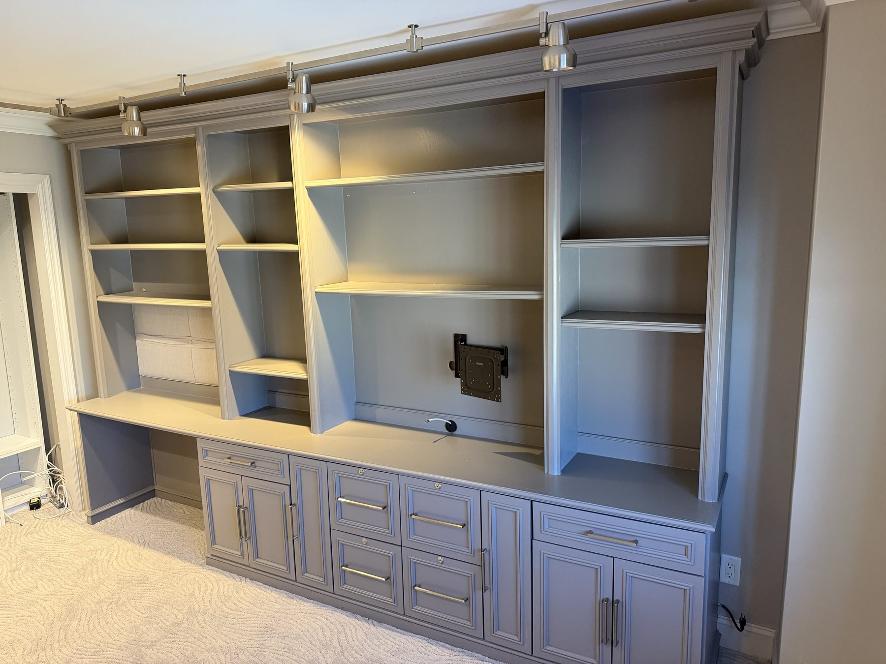 Large built-in wall unit removed by Jersey Junkers